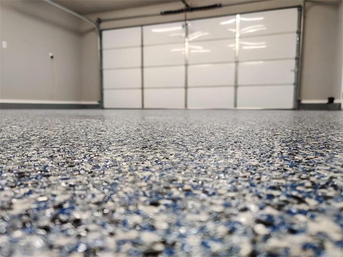 Low-angle view of coastal blue decorative flake garage floor coating