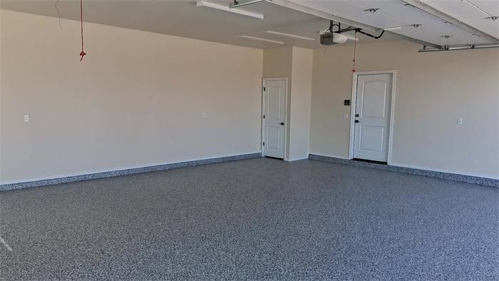 Wide view of a finished blue and gray decorative flake garage floor coating